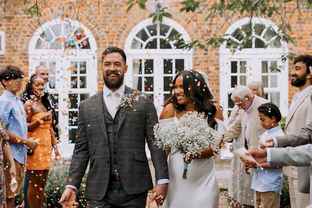 North London Wedding Photographer capturing confetti shot at a Wedding